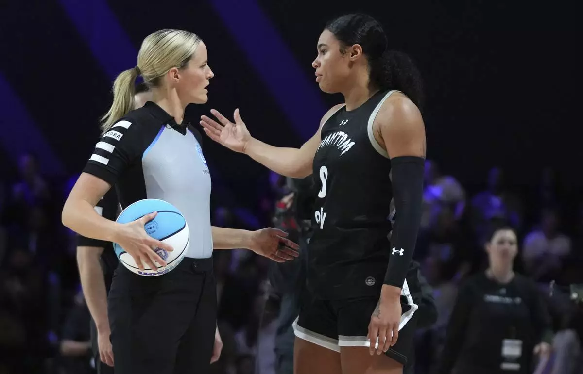 Phantom forward Satou Sabally (0) talks with an official during the first half of an Unrivaled 3-on-3 basketball game against Mist, Friday, Jan. 24, 2025, in Medley, Fla. (AP Photo/Lynne Sladky)