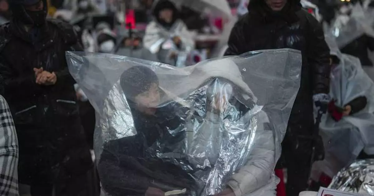 Top aide of impeached South Korean president pleads for investigators to halt detention efforts