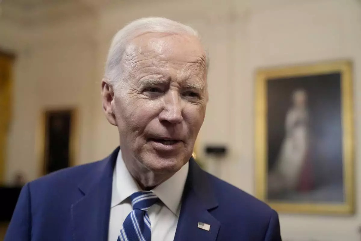 President Joe Biden speaks with reporters after signing the Social Security Fairness Act in the East Room of the White House, Sunday, Jan. 5, 2025, in Washington. (AP Photo/Manuel Balce Ceneta)