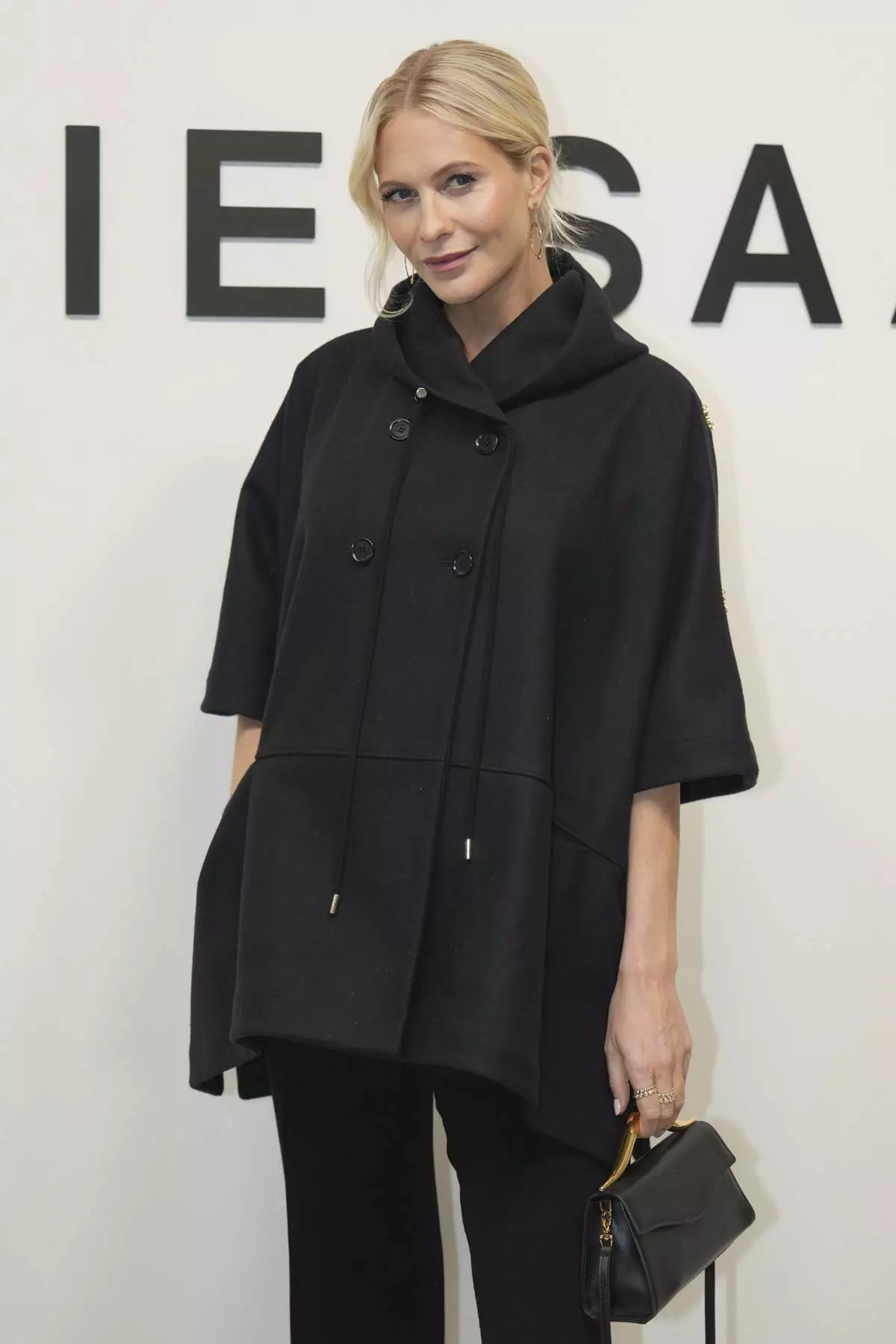 Poppy Delevingne poses before Elie Saab Haute Couture Spring Summer 2025 collection, that was presented in Paris, Wednesday, Jan. 29, 2025. (AP Photo/Lewis Joly)