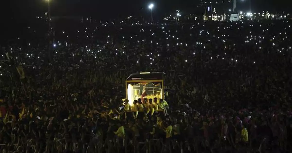 Filipino Catholics pray for good health and peace in huge procession venerating Jesus statue