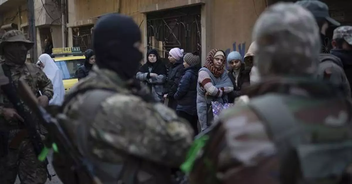 AP PHOTOS: Syria's new security forces conduct sweeps in Homs, looking for ousted Assad's loyalists