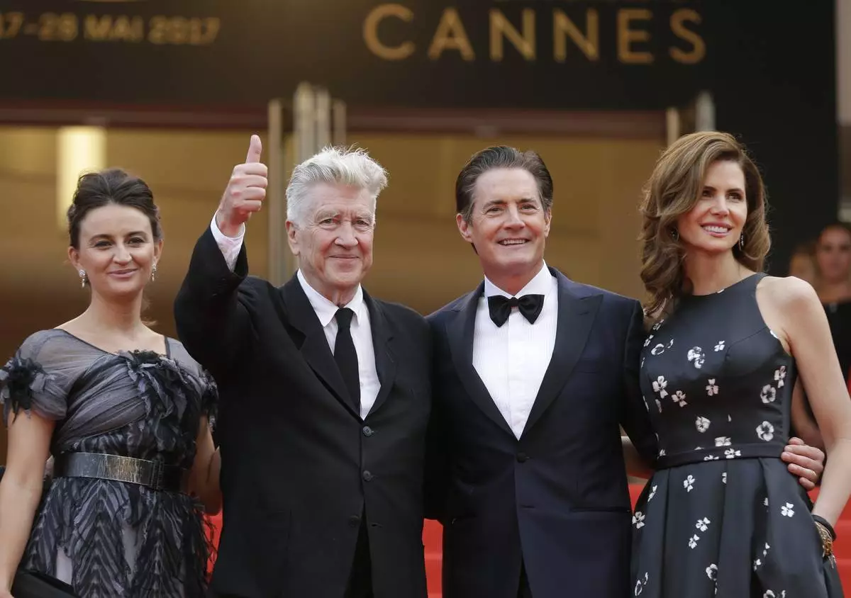 FILE - Emily Stofle, from left, director David Lynch actor Kyle MacLachlan, and Desiree Gruber appear at the screening of the TV series "Twin Peaks" at the 70th international film festival, Cannes, southern France, on May 25, 2017(AP Photo/Alastair Grant, File)