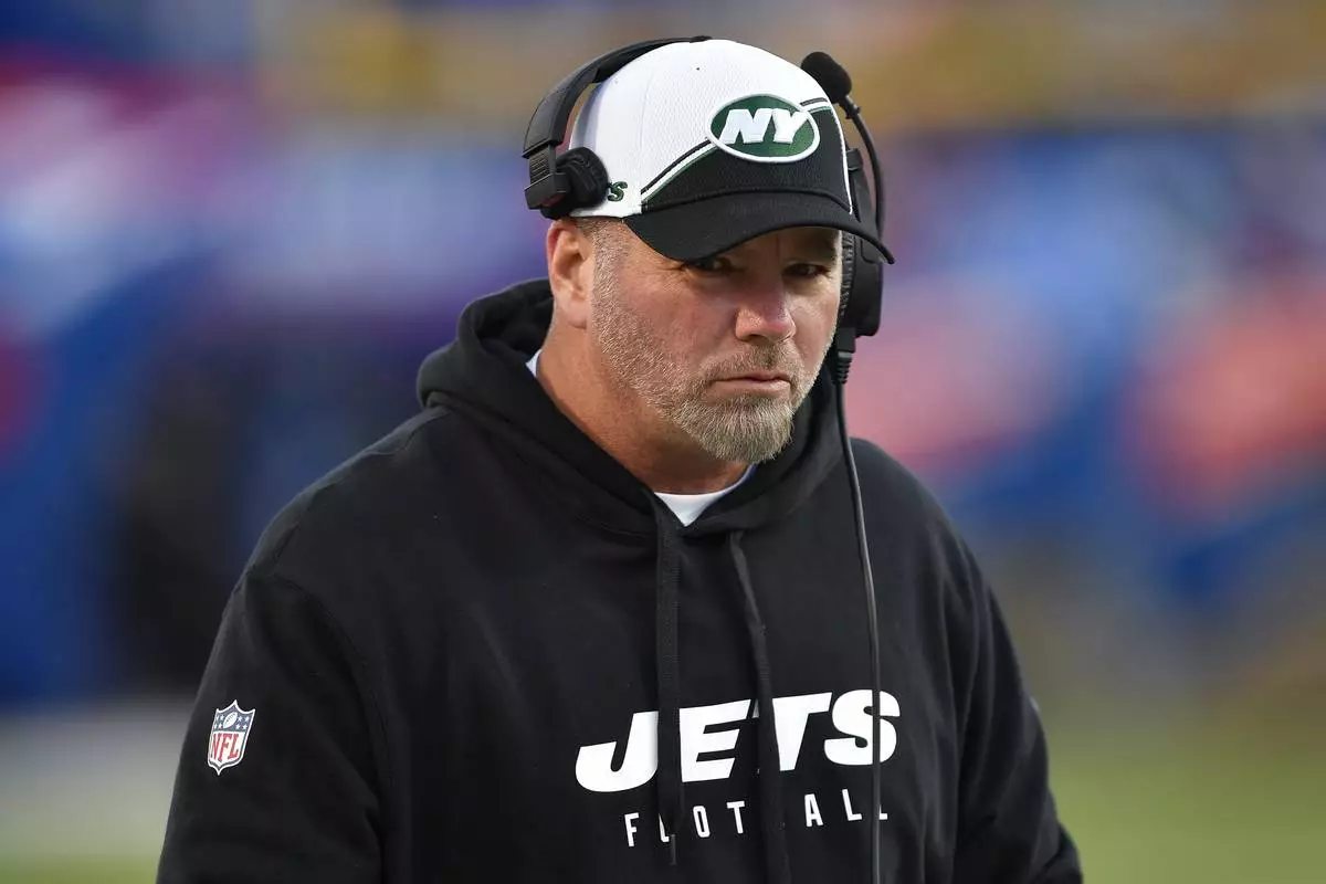 FILE - New York Jets special teams coordinator Brant Boyer watches warm ups before an NFL football game against the Buffalo Bills in Orchard Park, N.Y., Nov. 19, 2023. (AP Photo/Adrian Kraus, file)