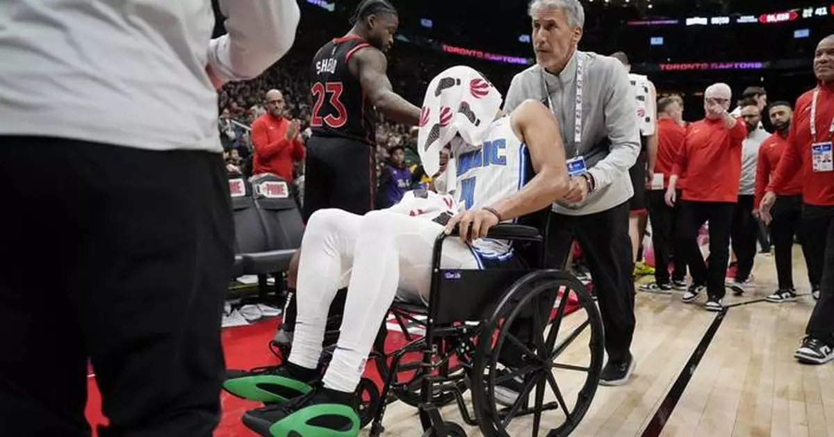 Magic's Jalen Suggs leaves game against Raptors in wheelchair because of back spasms