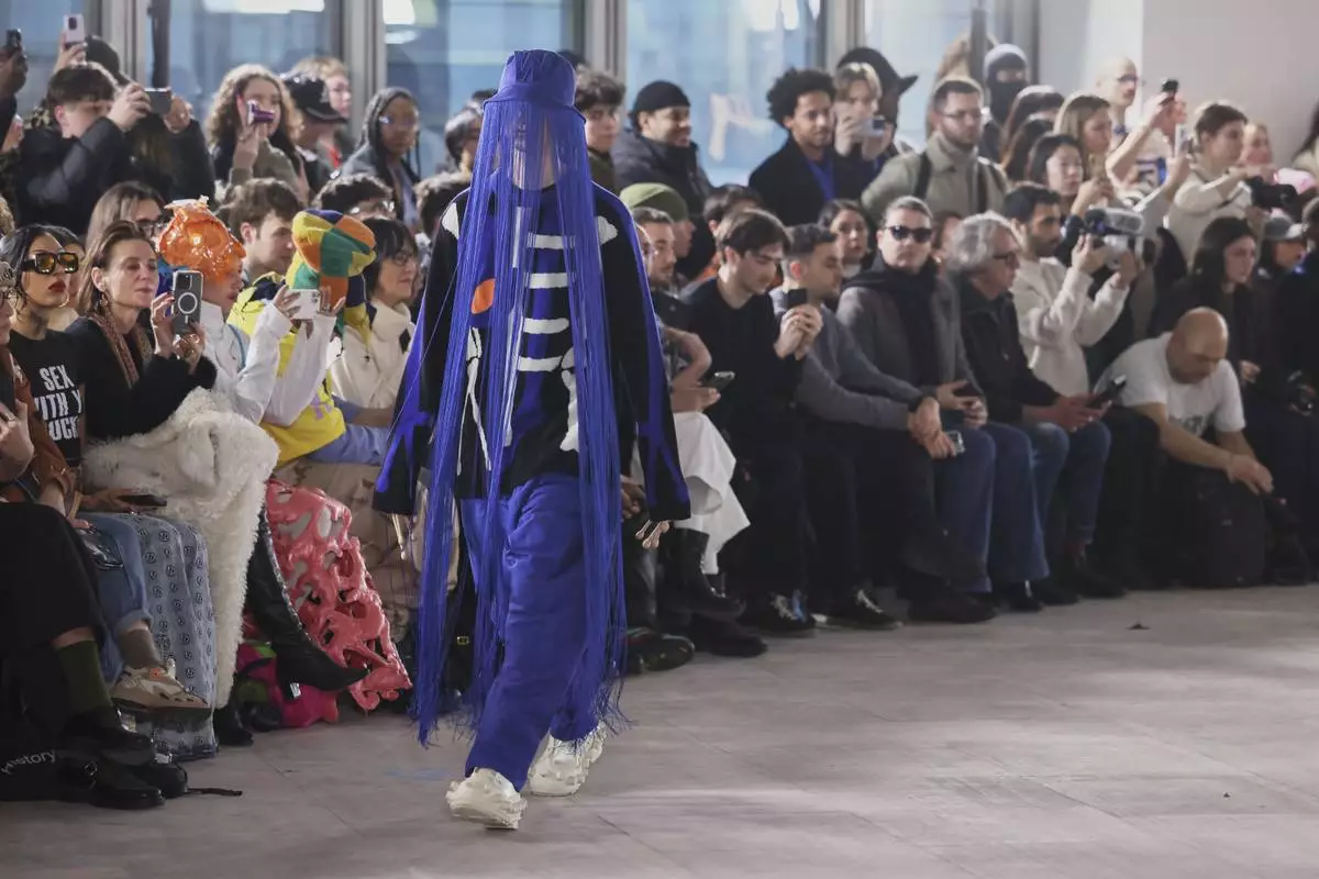 A model wears a creation as part of the men's Walter van Beirendonck Fall-Winter 2025-2026 collection, that was presented in Paris, Wednesday, Jan. 22, 2025. (AP Photo/Thomas Padilla).