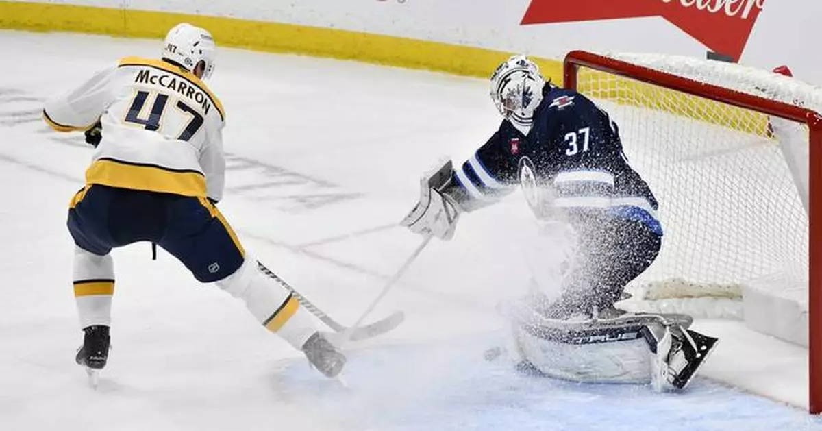 Connor Hellebuyck nets 300th win as Jets soar past Predators 5-2