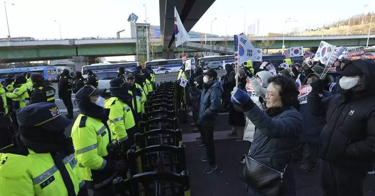 South Korea's impeached president defies warrant after hourslong standoff