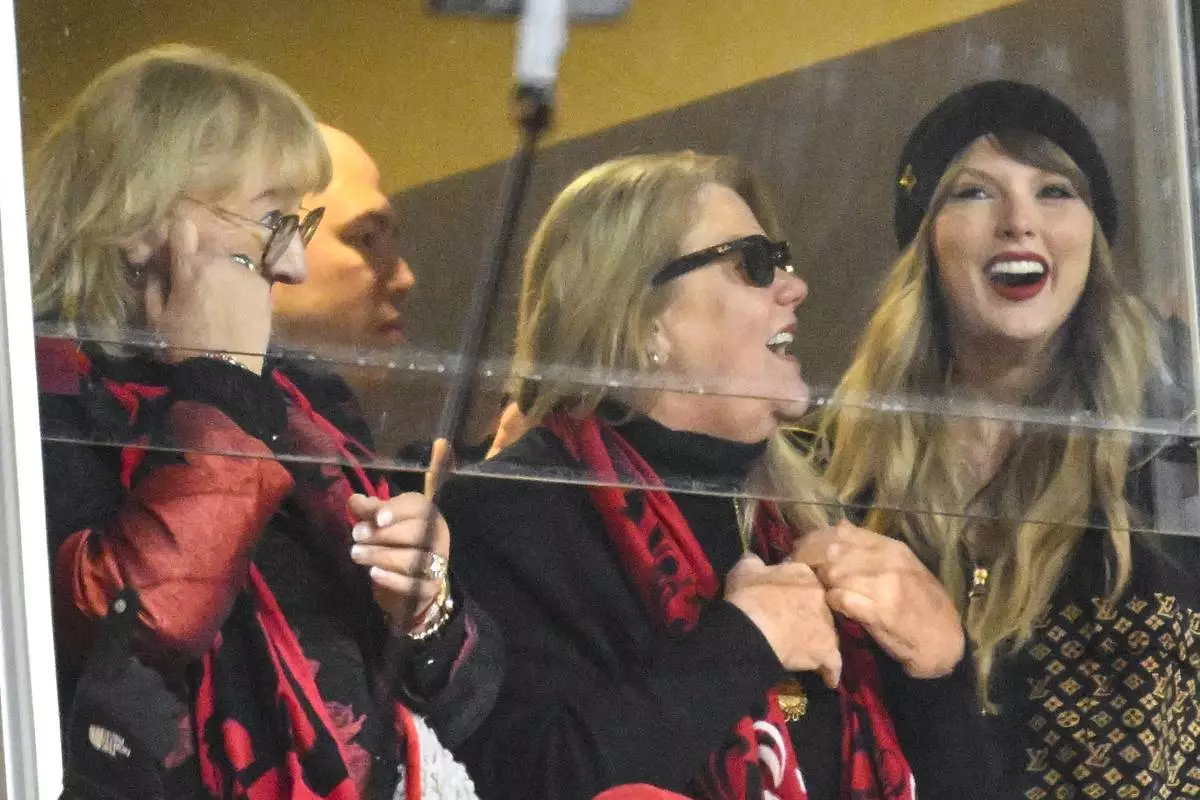 Donna Kelce, Andrea Swift and Taylor Swift, from left, watch play between the Kansas City Chiefs and the Buffalo Bills during the first half of the AFC Championship NFL football game, Sunday, Jan. 26, 2025, in Kansas City, Mo. (AP Photo/Reed Hoffmann)
