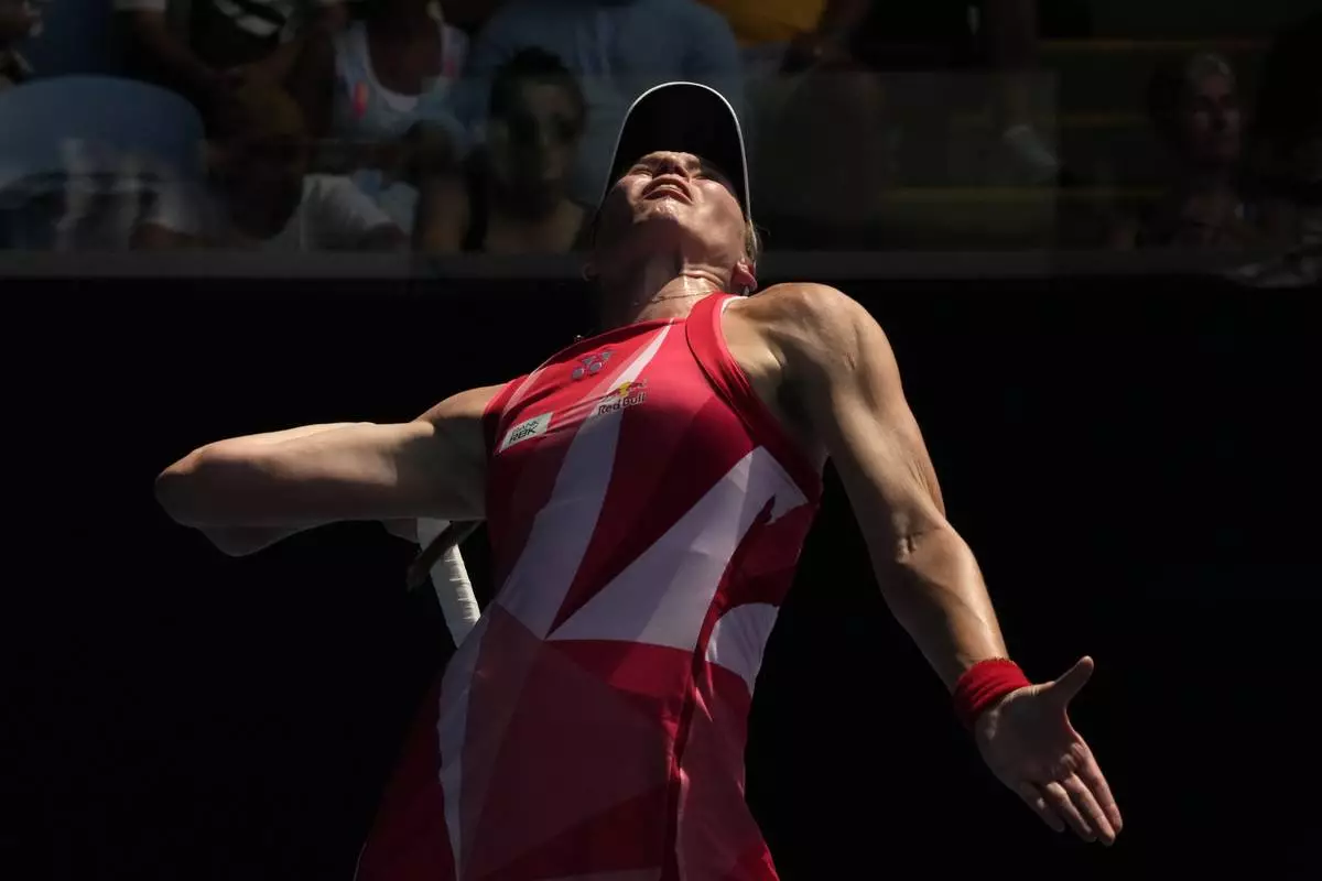 Elena Rybakina of Kazakhstan serves to Madison Keys of the U.S. during their fourth round match at the Australian Open tennis championship in Melbourne, Australia, Monday, Jan. 20, 2025. (AP Photo/Manish Swarup)
