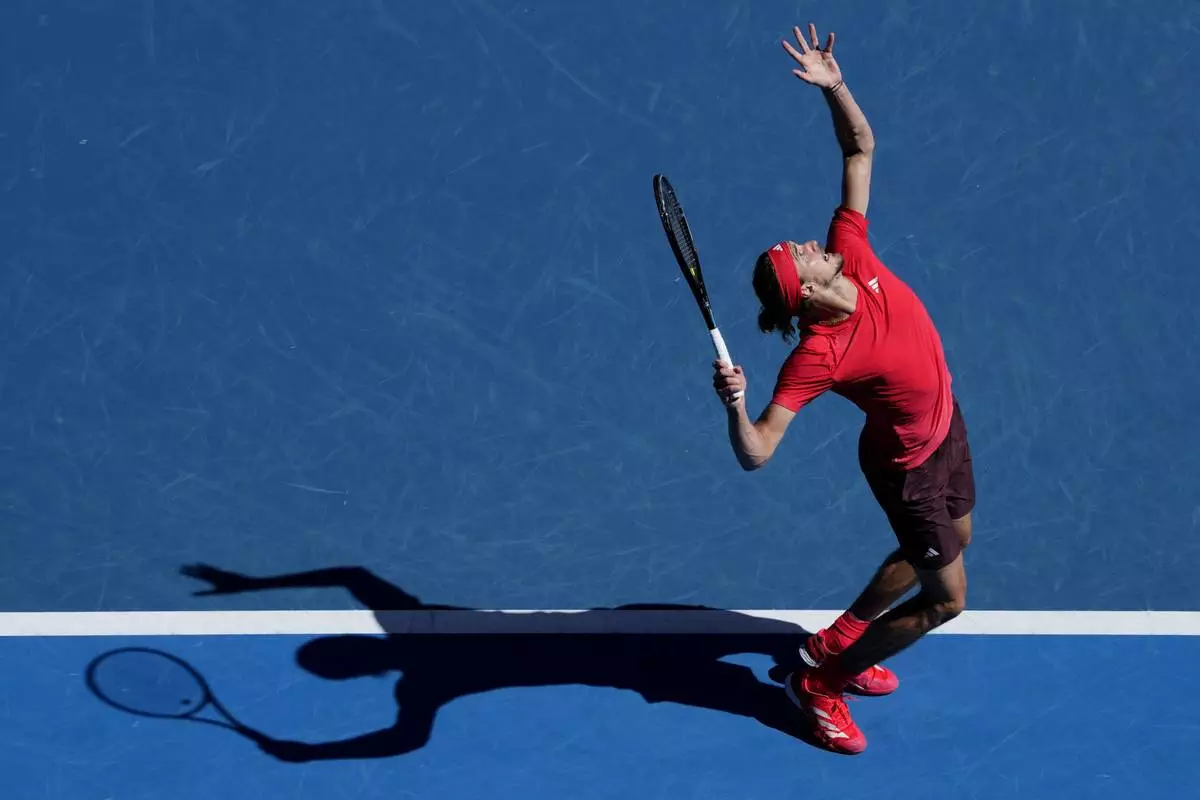 Alexander Zverev of Germany serves to Jacob Fearnley of Britain during their third round match at the Australian Open tennis championship in Melbourne, Australia, Friday, Jan. 17, 2025. (AP Photo/Vincent Thian)