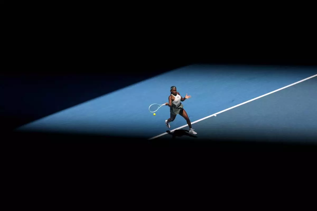 Coco Gauff of the U.S. plays a forehand return to Paula Badosa of Spain during their quarterfinal match at the Australian Open tennis championship in Melbourne, Australia, Tuesday, Jan. 21, 2025. (AP Photo/Asanka Brendon Ratnayake)