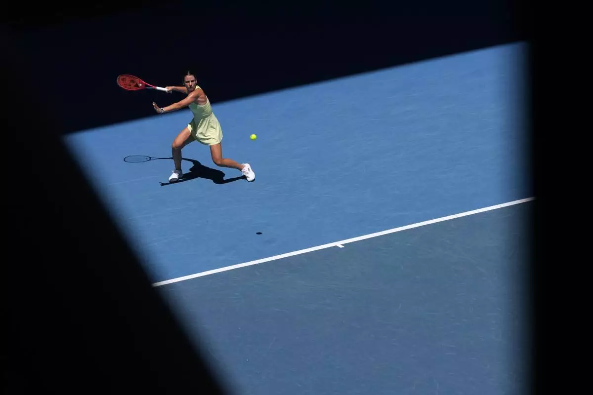 Emma Navarro of the U.S. plays a forehand return to Ons Jabeur of Tunisia during their third round match at the Australian Open tennis championship in Melbourne, Australia, Saturday, Jan. 18, 2025. (AP Photo/Manish Swarup)