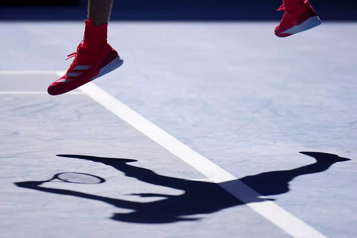 Alexander Zverev of Germany serves to Tommy Paul of the U.S. during their quarterfinal match at the Australian Open tennis championship in Melbourne, Australia, Tuesday, Jan. 21, 2025. (AP Photo/Vincent Thian)