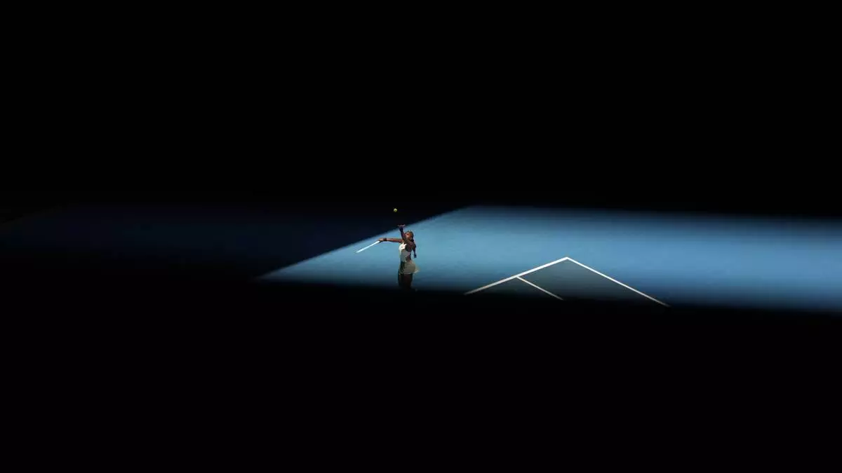 Coco Gauff of the U.S. serves to Paula Badosa of Spain during their quarterfinal match at the Australian Open tennis championship in Melbourne, Australia, Tuesday, Jan. 21, 2025. (AP Photo/Asanka Brendon Ratnayake)