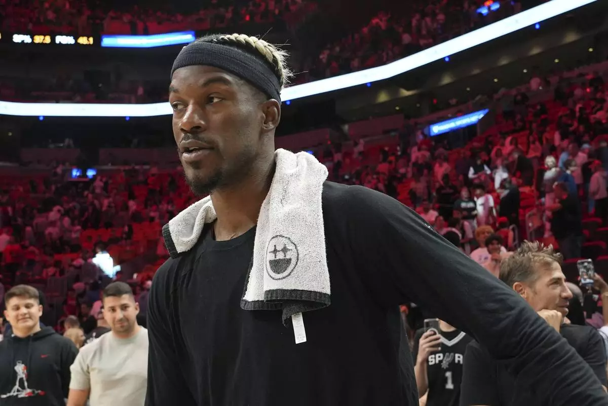 Miami Heat forward Jimmy Butler walks on the court after an NBA basketball game against the San Antonio Spurs, Sunday, Jan. 19, 2025, in Miami. (AP Photo/Lynne Sladky)