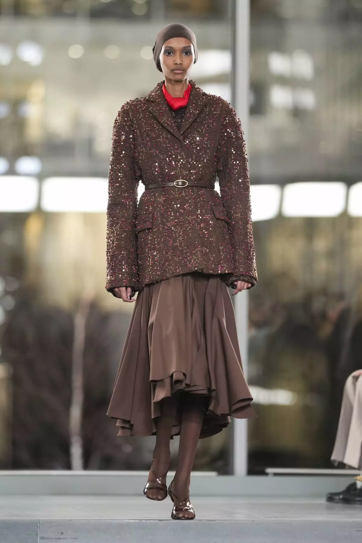 A model walks the runway during the Tory Burch Fall/Winter 2025 fashion show as part of New York Fashion Week on Monday, Feb. 10, 2025, at the Museum of Modern Art in New York. (Photo by Charles Sykes/Invision/AP)