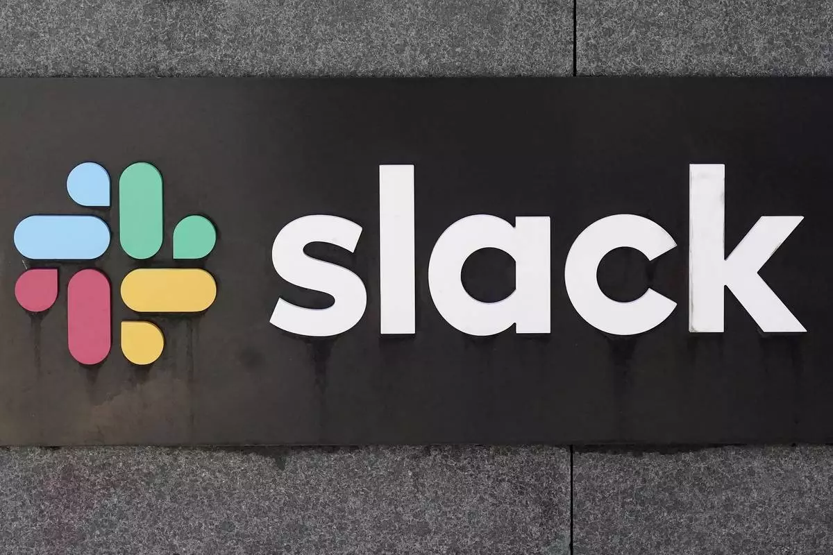 FILE - A Slack sign is shown outside of the company's office in San Francisco, Monday, March 13, 2023. (AP Photo/Jeff Chiu, File)