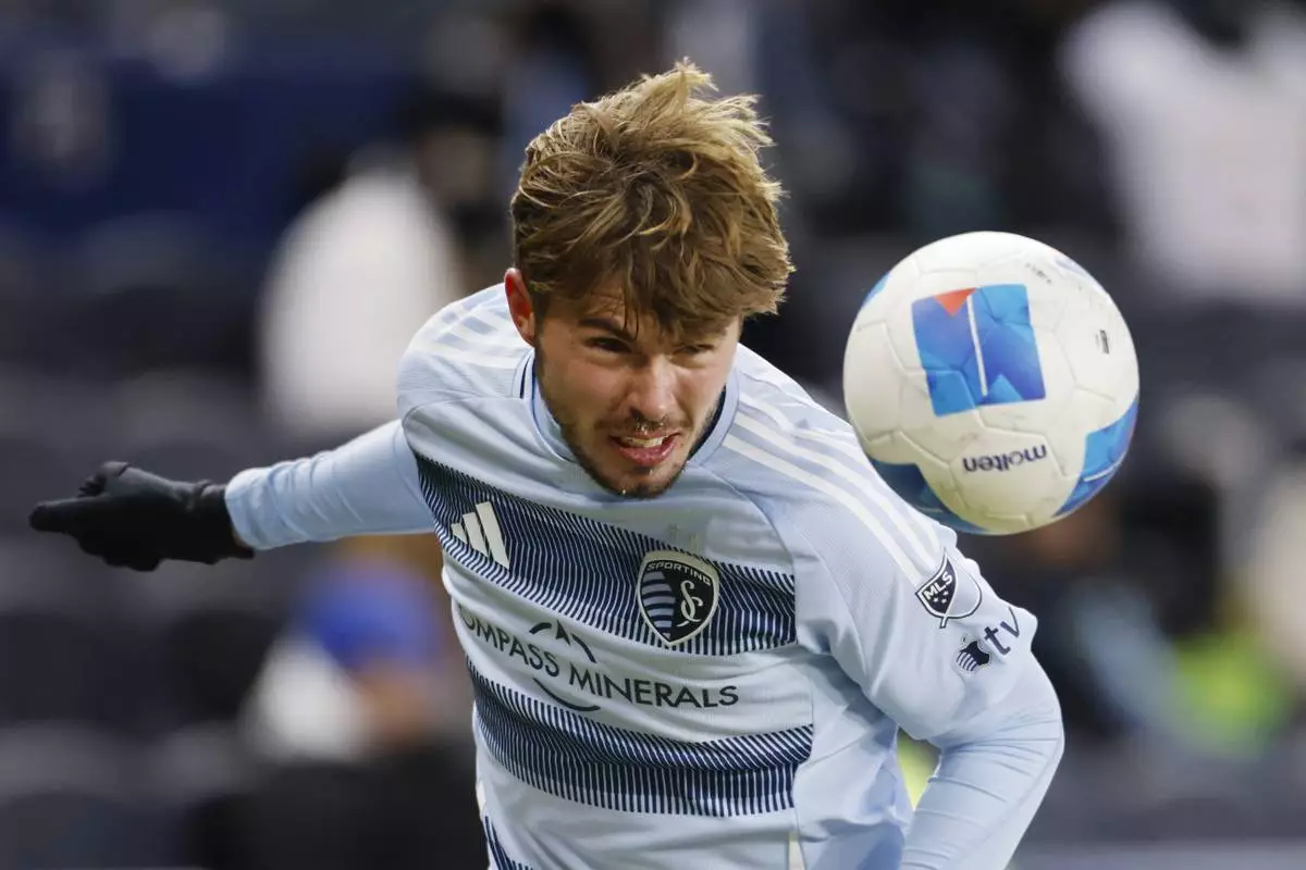Sporting Kansas City midfielder Jake Davis heads the ball during a failed scoring attempt against Inter Miami during the second half of a CONCACAF Champions Cup soccer match, Wednesday, Feb. 19, 2025, in Kansas City, Kan. (AP Photo/Colin E. Braley