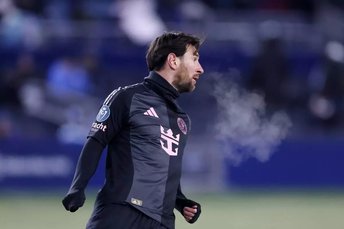 Inter Miami forward Lionel Messi looks down the pitch as he plays in subzero temperatures during the first half of a CONCACAF Champions Cup soccer match against Sporting Kansas City, Wednesday, Feb. 19, 2025, in Kansas City, Kan. (AP Photo/Colin E. Braley)