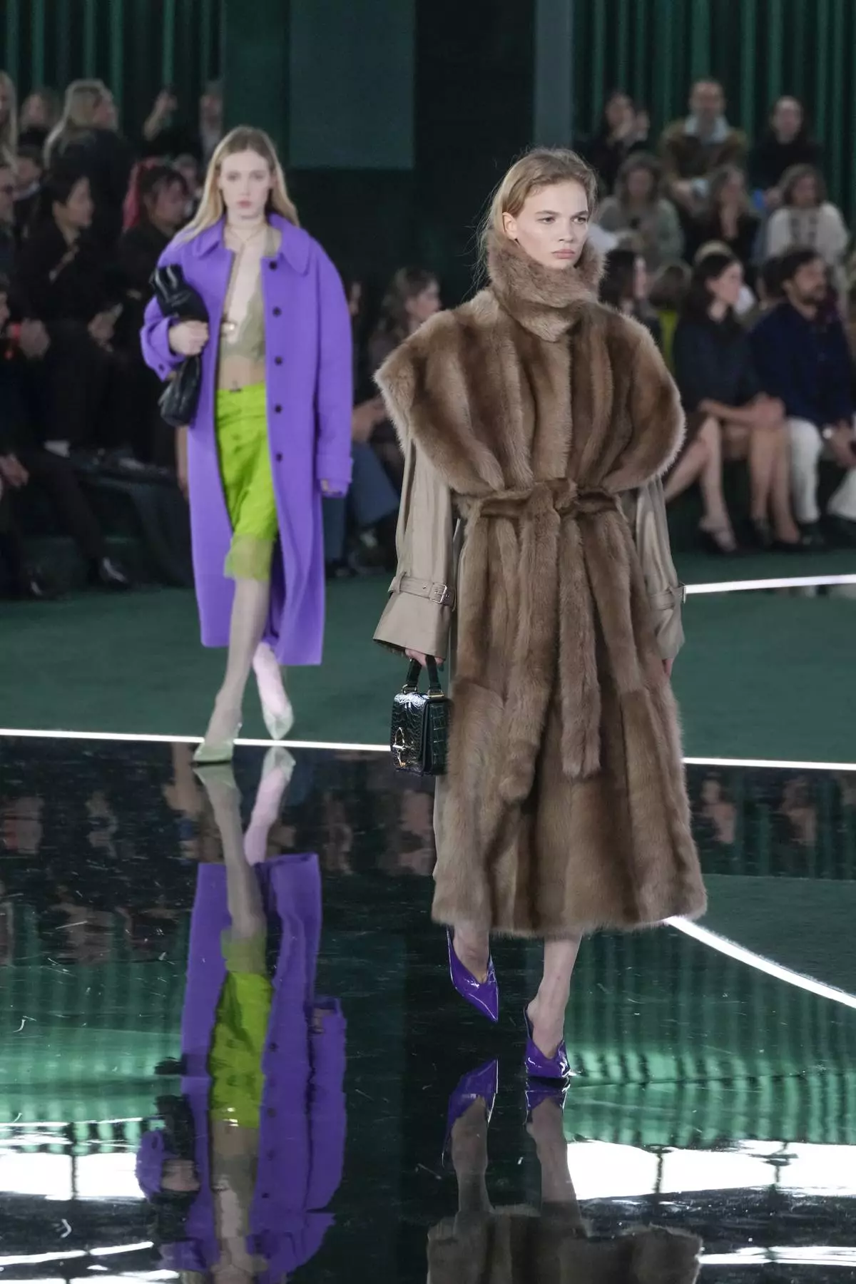 A model wears a creation as part of the Gucci Fall/Winter 2025-2026 men's and women's collection, presented in Milan, Italy, Tuesday, Feb. 25, 2025. (AP Photo/Luca Bruno)