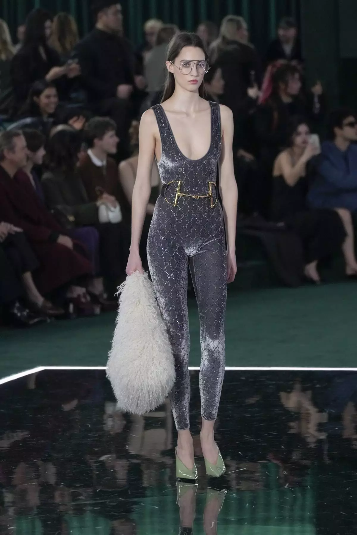 A model wears a creation as part of the Gucci Fall/Winter 2025-2026 men's and women's collection, presented in Milan, Italy, Tuesday, Feb. 25, 2025. (AP Photo/Luca Bruno)