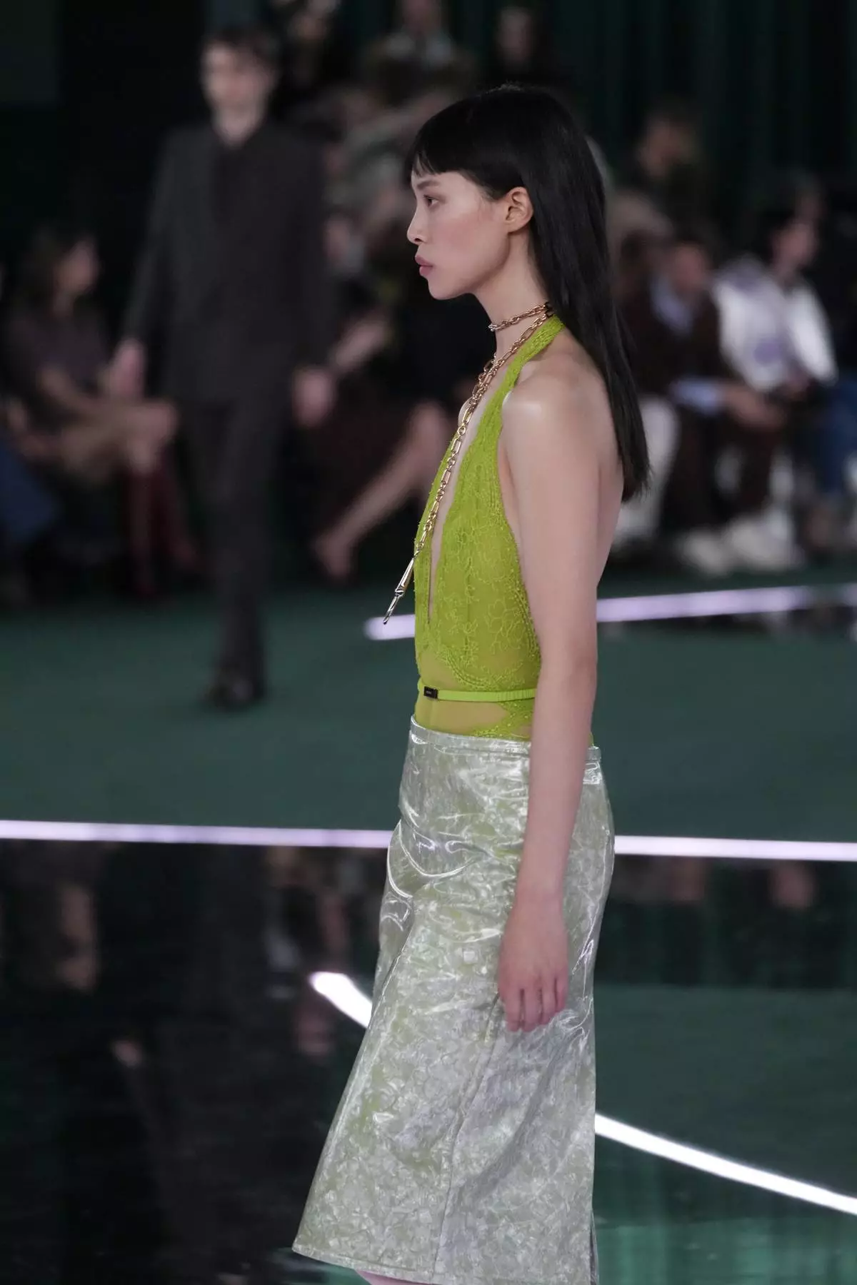 A model wears a creation as part of the Gucci Fall/Winter 2025-2026 men's and women's collection, presented in Milan, Italy, Tuesday, Feb. 25, 2025. (AP Photo/Luca Bruno)