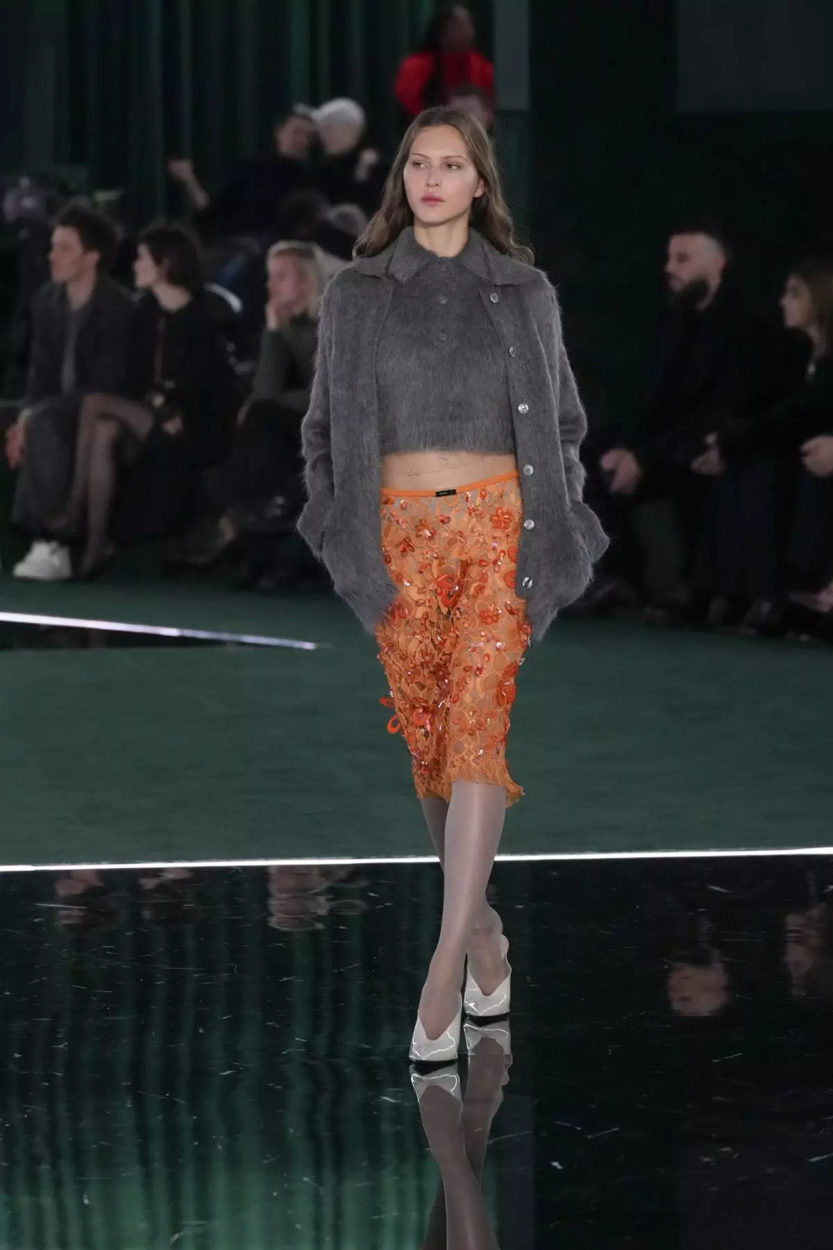 A model wears a creation as part of the Gucci Fall/Winter 2025-2026 men's and women's collection, presented in Milan, Italy, Tuesday, Feb. 25, 2025. (AP Photo/Luca Bruno)