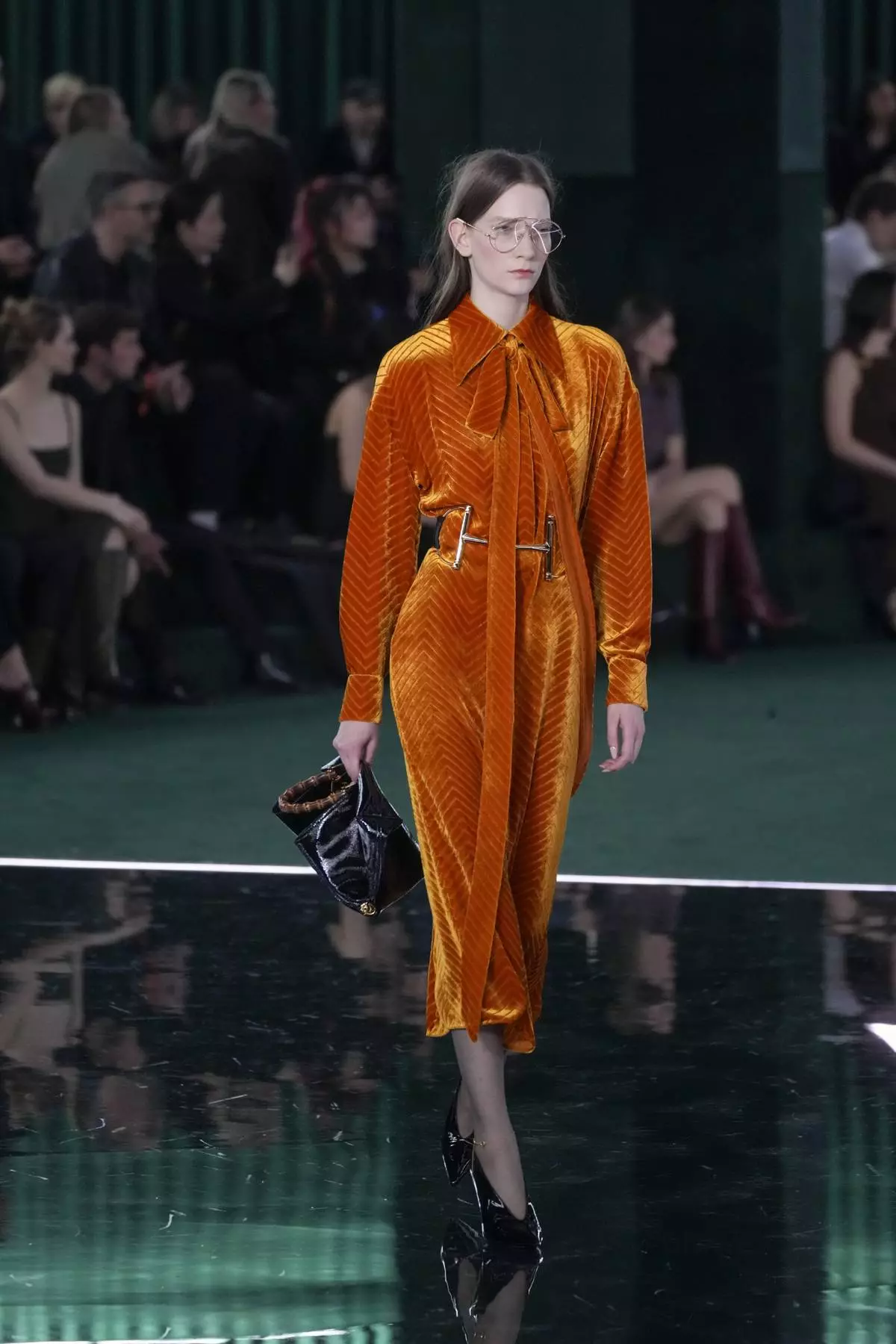A model wears a creation as part of the Gucci Fall/Winter 2025-2026 men's and women's collection, presented in Milan, Italy, Tuesday, Feb. 25, 2025. (AP Photo/Luca Bruno)
