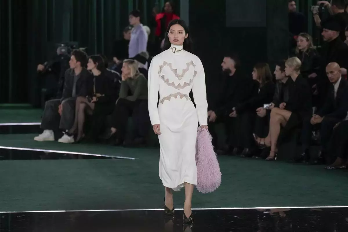 A model wears a creation as part of the Gucci Fall/Winter 2025-2026 men's and women's collection, presented in Milan, Italy, Tuesday, Feb. 25, 2025. (AP Photo/Luca Bruno)