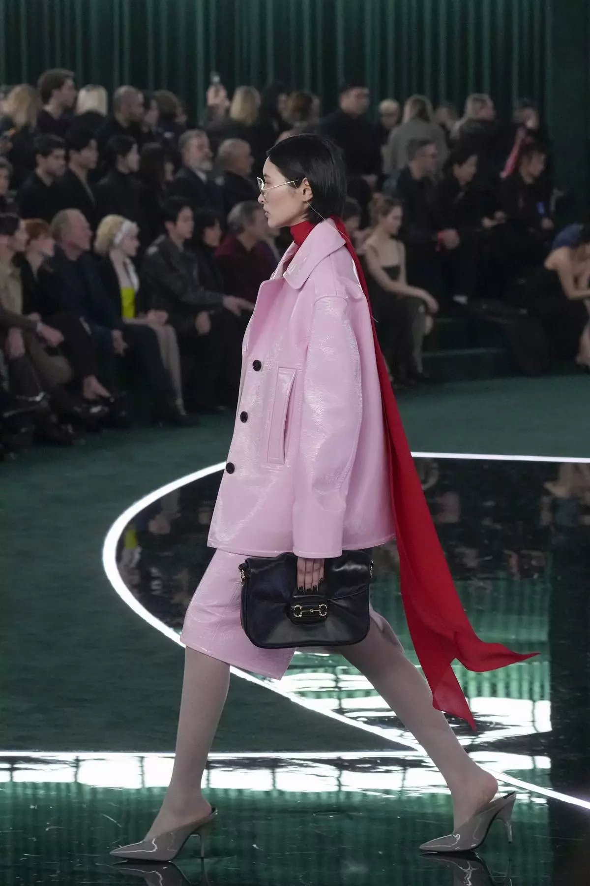 A model wears a creation as part of the Gucci Fall/Winter 2025-2026 men's and women's collection, presented in Milan, Italy, Tuesday, Feb. 25, 2025. (AP Photo/Luca Bruno)