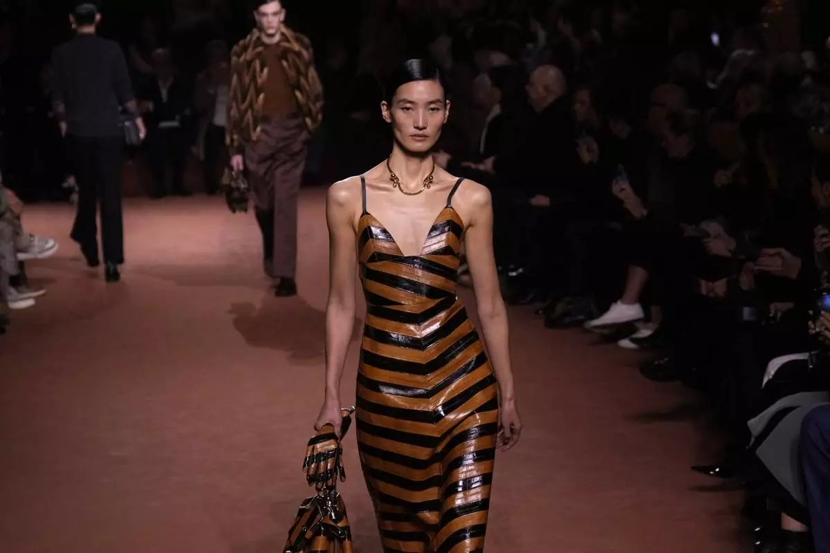 A model wears a creation of the Fendi Fall/Winter 2025-2026 women's collection presented in Milan, Italy, Wednesday, Feb. 26, 2025. (AP Photo/Luca Bruno)