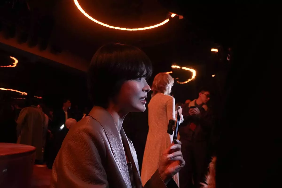South Korean actress Song Hye-kyo waits for the start of the Fendi Fall/Winter 2025-2026 women's collection in Milan, Italy, Wednesday, Feb. 26, 2025. (AP Photo/Luca Bruno)