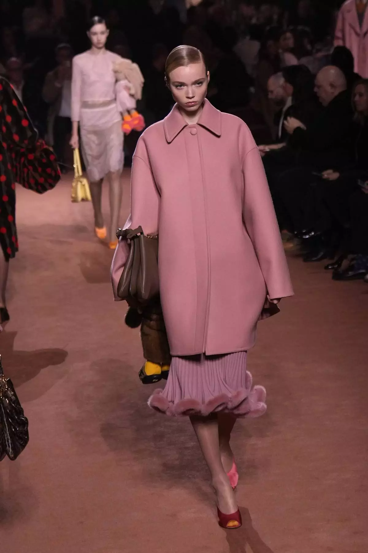 A model wears a creation of the Fendi Fall/Winter 2025-2026 women's collection presented in Milan, Italy, Wednesday, Feb. 26, 2025. (AP Photo/Luca Bruno)