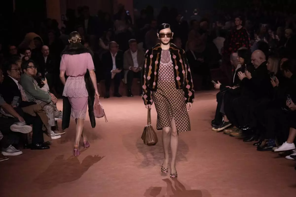 Models wear creations of the Fendi Fall/Winter 2025-2026 women's collection presented in Milan, Italy, Wednesday, Feb. 26, 2025. (AP Photo/Luca Bruno)