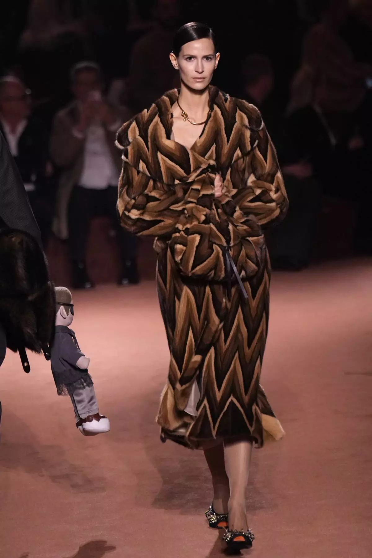 A model wears a creation of the Fendi Fall/Winter 2025-2026 women's collection presented in Milan, Italy, Wednesday, Feb. 26, 2025. (AP Photo/Luca Bruno)