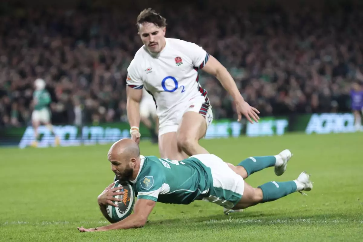 Ireland's Jamison Gibson-Park scores his side's first try during the Six Nations rugby union match between Ireland and England at the Aviva Stadium in Dublin, Saturday, Feb. 1, 2025. (AP Photo/Peter Morrison)