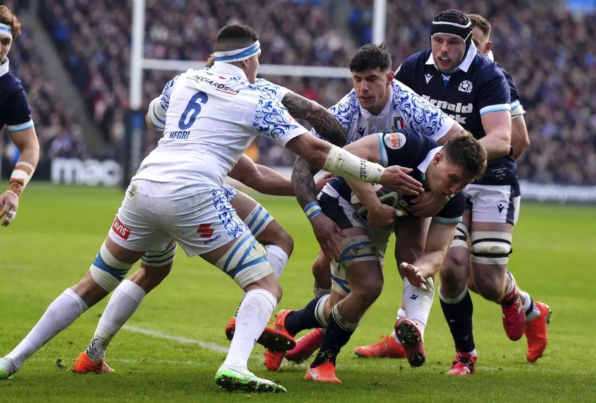 Scotland's Rory Darge scores the opening try during the Six Nations rugby union match between Scotland and Italy, at Murrayfield Stadium, Edinburgh, Scotland, Saturday Feb. 1, 2025. (Andrew Milligan/PA via AP)