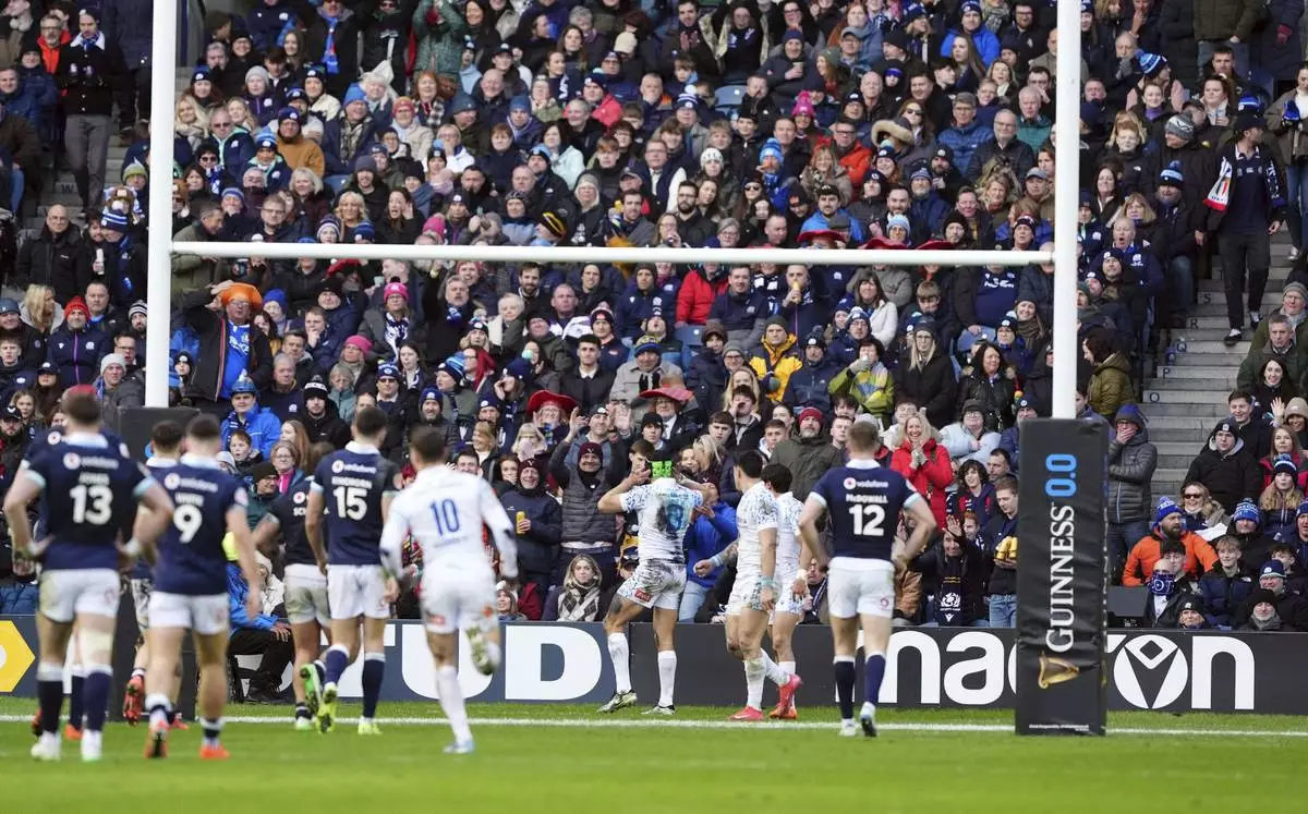 Italy's Juan Ignacio Brex (centre) after scoring a try during the Six Nations rugby union match between Scotland and Italy, at Murrayfield Stadium, Edinburgh, Scotland, Saturday Feb. 1, 2025. (Andrew Milligan/PA via AP)