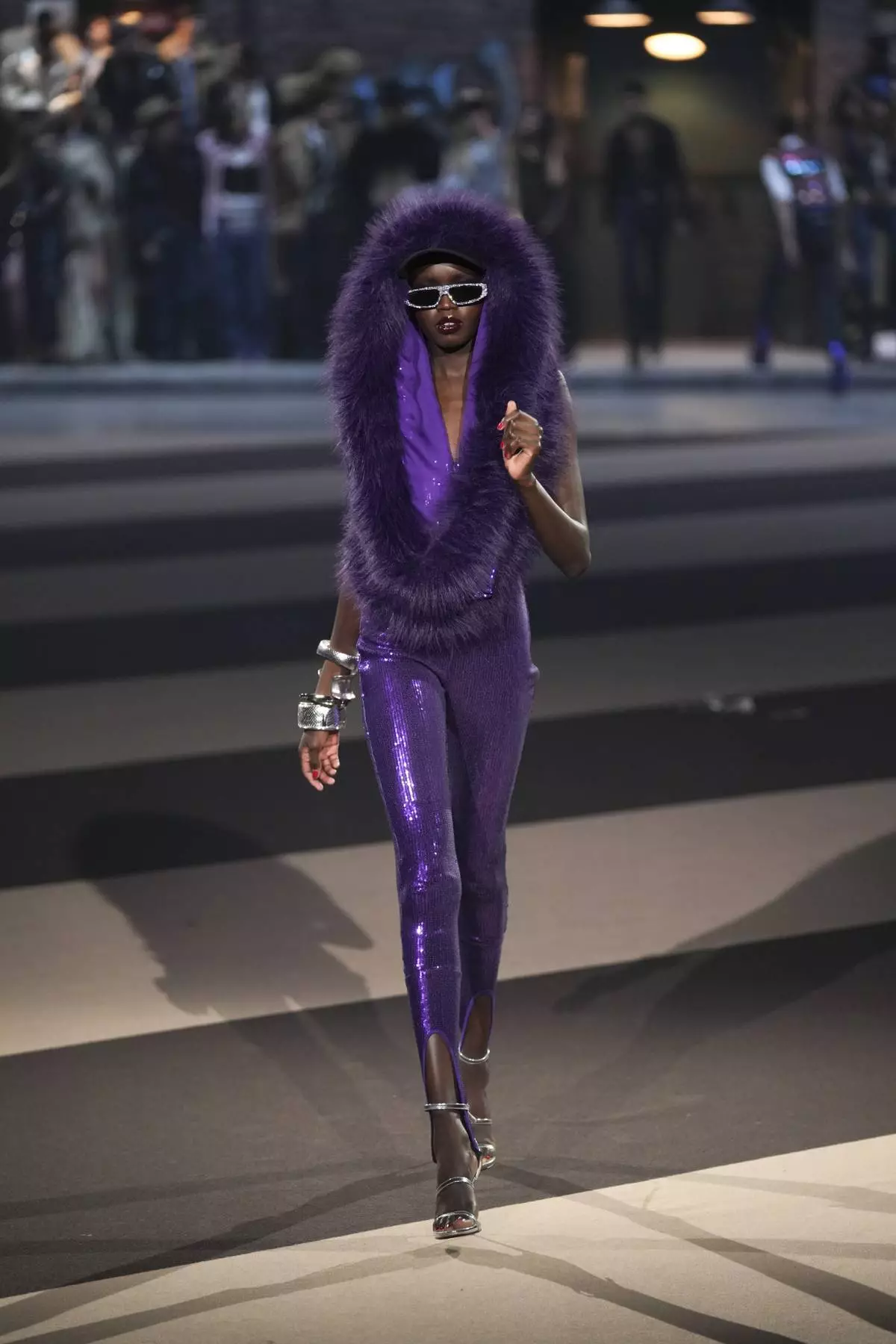 A model wears a creation as part of the Dsquared2 Fall/Winter 2025-2026 men's and women's collection presented in Milan, Italy, Tuesday, Feb. 25, 2025. (AP Photo/Antonio Calanni)
