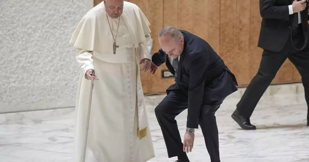 Pope Francis stumbles while walking into Jubilee audience at the Vatican as his walking stick snaps