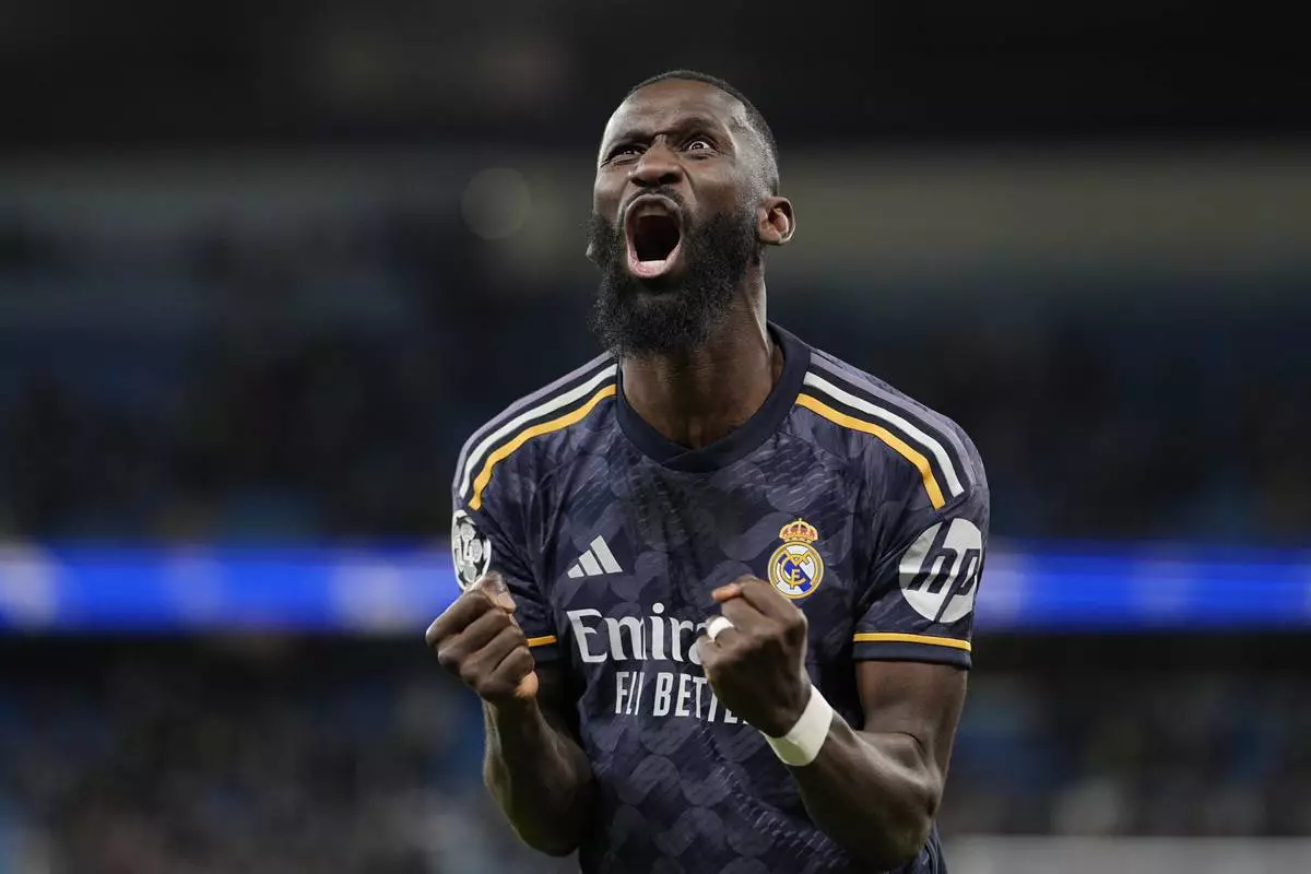 FILE - Real Madrid's Antonio Rudiger celebrates at the end of the Champions League quarterfinal second leg soccer match between Manchester City and Real Madrid at the Etihad Stadium in Manchester, England, Wednesday, April 17, 2024. (AP Photo/Dave Shopland, File)