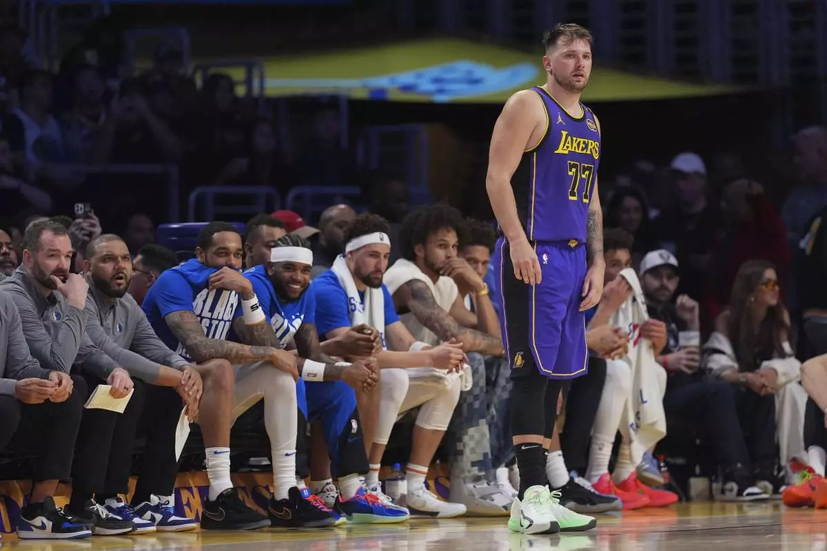 Los Angeles Lakers guard Luka Doncic (77) stands on the court during the second half of an NBA basketball game against the Dallas Mavericks, Tuesday, Feb. 25, 2025, in Los Angeles. (AP Photo/Mark J. Terrill)