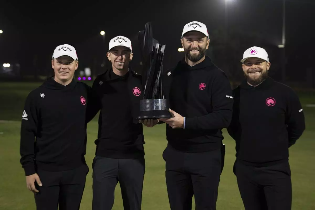 First place team champions Caleb Surratt of Legion XIII, Tom McKibbin of Legion XIII, Captain Jon Rahm of Legion XIII and Tyrrell Hatton of Legion XIII pose with the trophy on the 18th green after the final round of the LIV Golf tournament at Riyadh Golf Club, Saturday, Feb. 8, 2025 in Riyadh, Saudi Arabia. (Photo by Montana Pritchard/LIV Golf via AP)