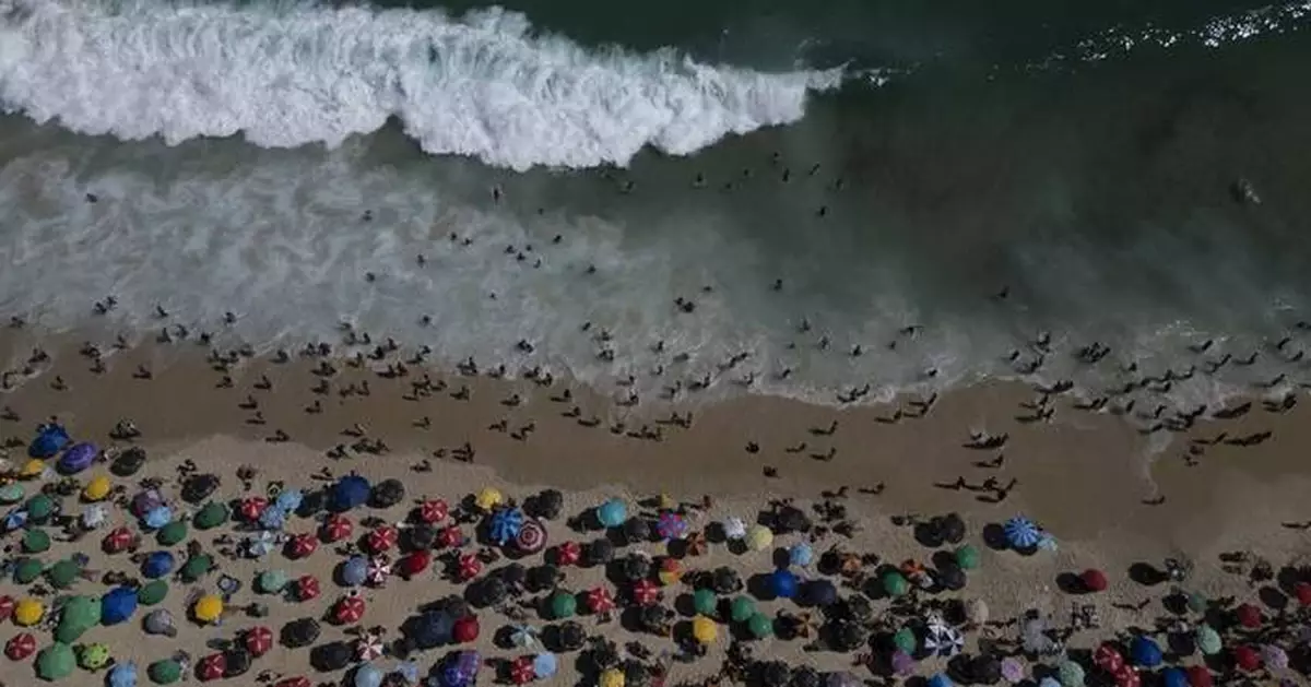 Rio de Janeiro's hottest day in at least a decade sends residents to the beach