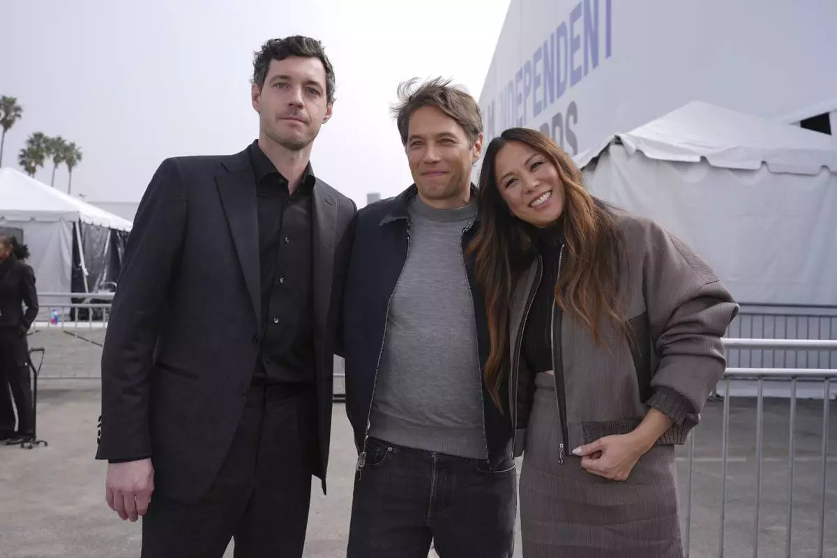 Alex Coco, from left, Sean Baker and Samantha Quan arrive at the Film Independent Spirit Awards on Saturday, Feb. 22, 2025, in Santa Monica, Calif. (AP Photo/Chris Pizzello)