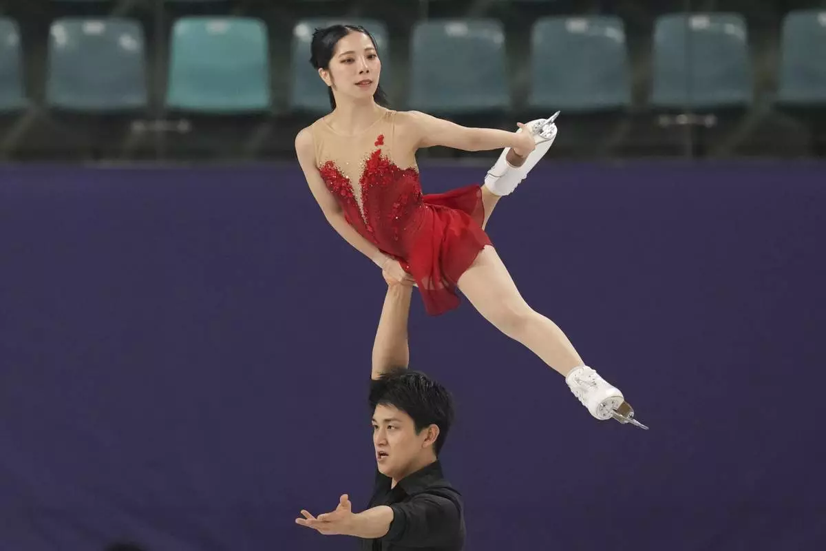 Riku Miura, top, and Ryuichi Kihara of Japan perform during the pairs free skating at the ISU Four Continents Figure Skating Championships at the Mokdong ice rink in Seoul, South Korea, Friday, Feb. 21, 2025. (AP Photo/Lee Jin-man)
