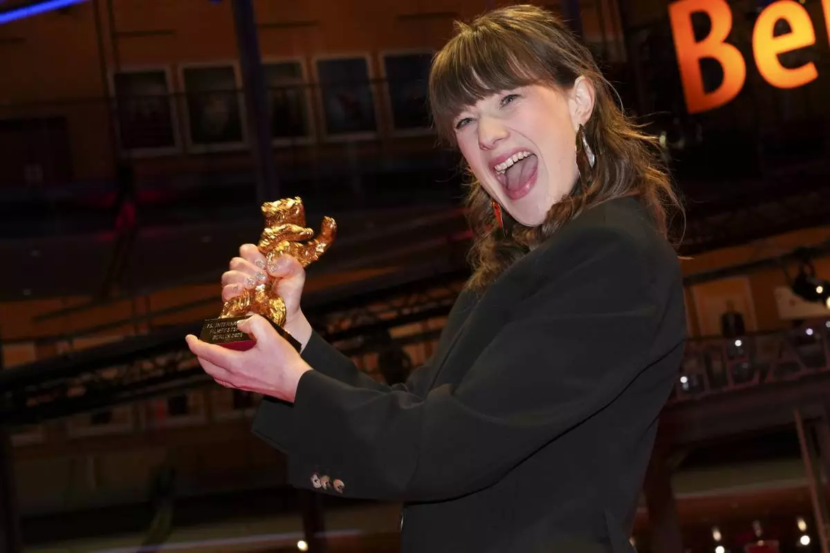 Hege Hauff Hvattum, winner of the Golden Bear for best film for 'Dreams (Sex Love)', poses for photographers at the winners photo call during the International Film Festival, Berlinale, in Berlin, Saturday, Feb. 22, 2025. (Photo by Scott A Garfitt/Invision/AP).