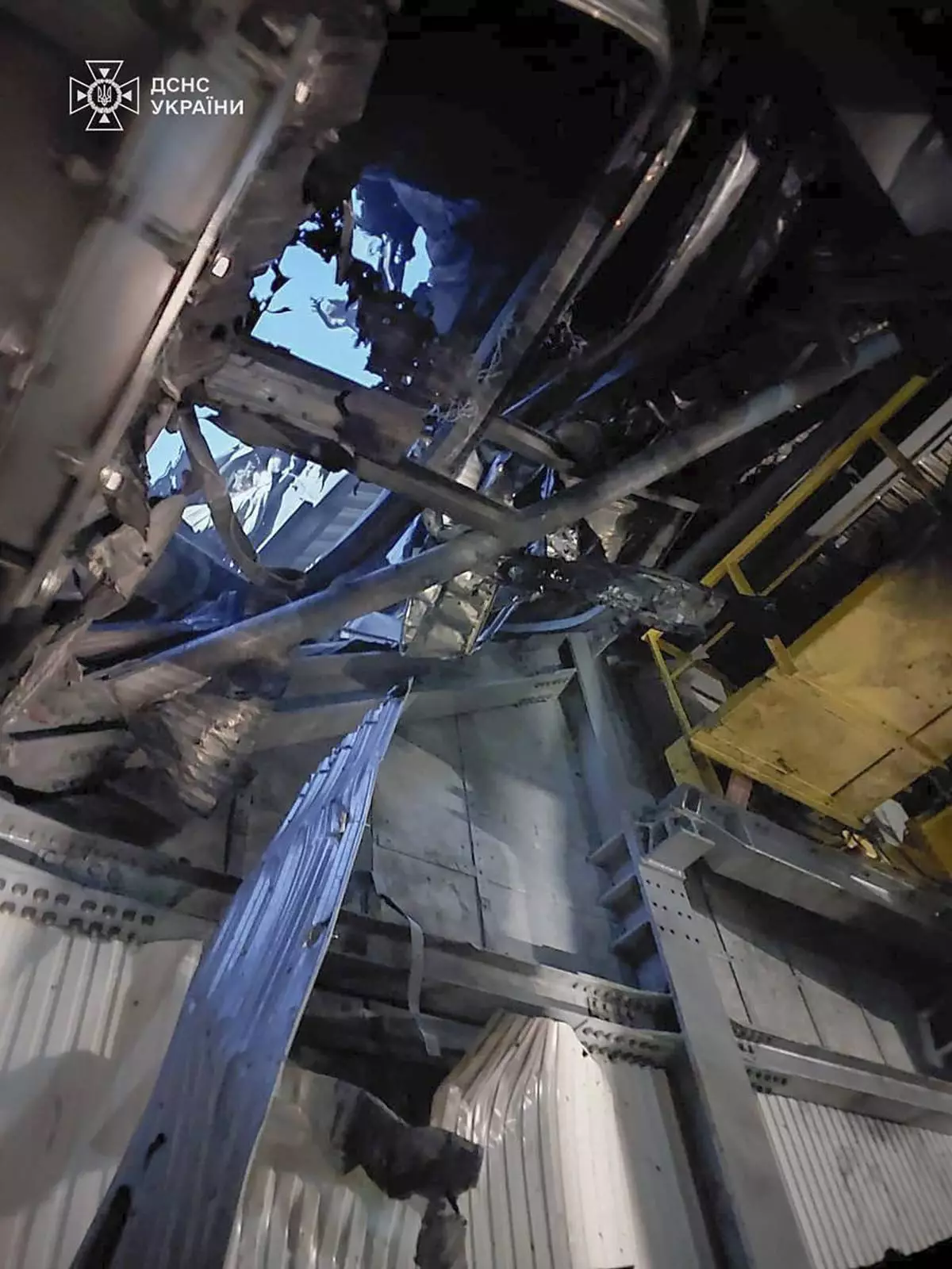 In this photo provided by the Ukrainian Emergency Service, damaged sarcophagus that covers the destroyed 4th reactor of Chernobyl nuclear power plant is seen from inside following a Russian drone attack in Chernobyl, Ukraine, Friday, Feb. 14, 2025. (Ukrainian Emergency Service via AP)