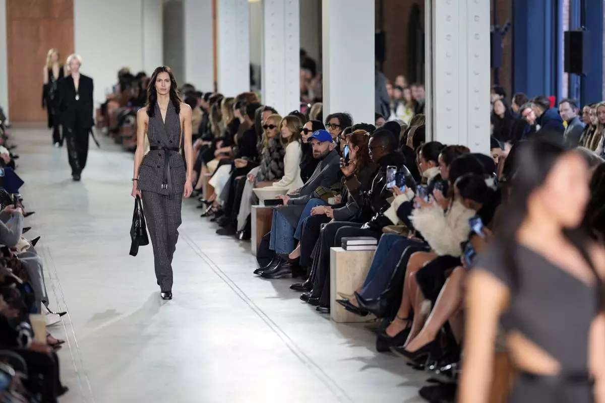Models walk the runway during the Michael Kors Fall/Winter 2025 fashion show as part of New York Fashion Week on Tuesday, Feb. 11, 2025, at Terminal Warehouse in New York. (Photo by Charles Sykes/Invision/AP)